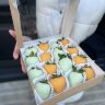 Коробочка из 16 клубник в апельсиновом и лимонном шоколаде